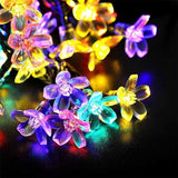 Solar LED String Lichten - Multi- Kleur Bloemen Tuin Verlichting - 10 Meter - 60LED Lichtslinger - Sfeerverlichting - Voor binnen en buiten - Decorative Lighting - Lichtsnoeren -Tuinverlichting zonne-energie - Fairy Lights - Bloem Figuur